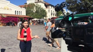 Female journalist reporter with microphone