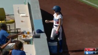 Dodger ball girl at baseball game