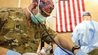 Nurse anesthetist helping a patient