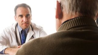 Doctor speaking with patient