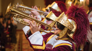 Trojan Marching band players playing trumpet