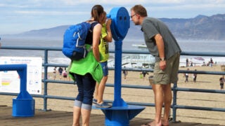 Family looking out at Santa Monica Pier