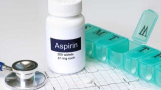 Aspirin pill bottle and stethoscope