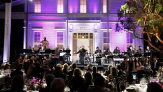 The Widney Alumni House provides a dramatic backdrop for student performers entertaining the Widney Society gala crowd