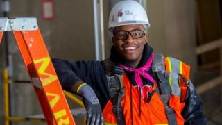 Worker in hard hat and orange vest