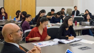 Students taking notes in class