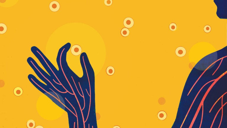 Man with veins outlined holding a cell in one hand with cells floating around