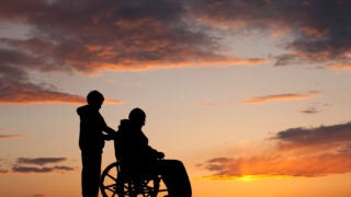Silhouette of Man in a Wheelchair