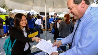 students speaking to employer