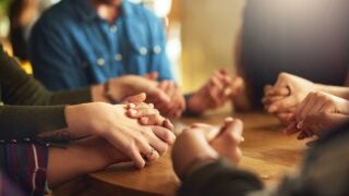 close-up of group holding hands