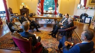 lawmakers seated in a circle