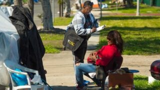 woman standing on sidewalk