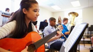 student playing guitar