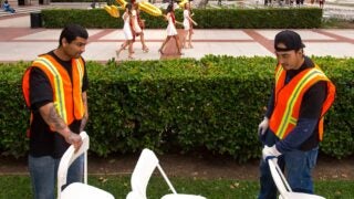 workers setting up chairs