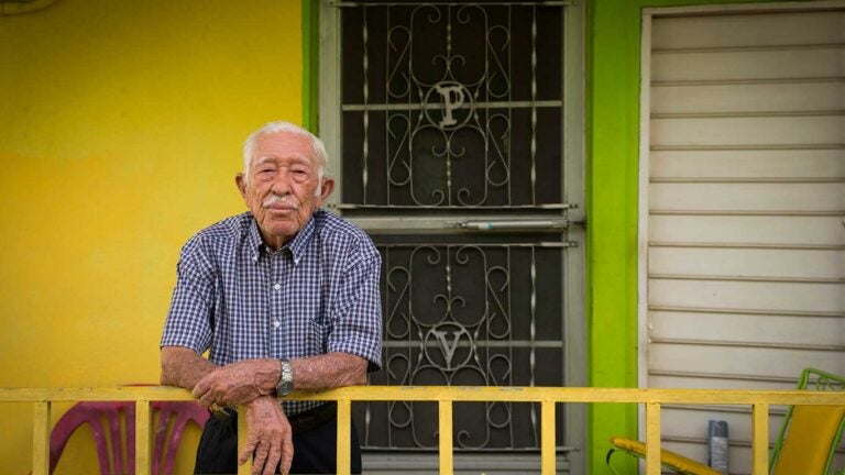 elderly man on porch