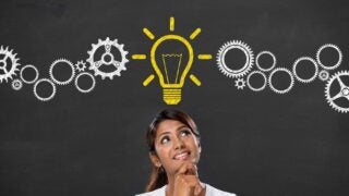 woman with light bulb above head