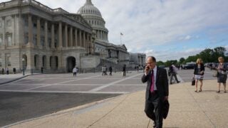 C. L. Max Nikias walking outside the Capitol