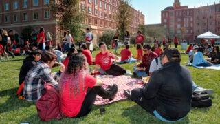 high school gathered on village lawn
