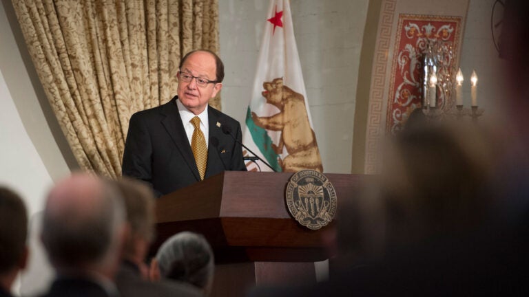 C. L. Max Nikias at a podium