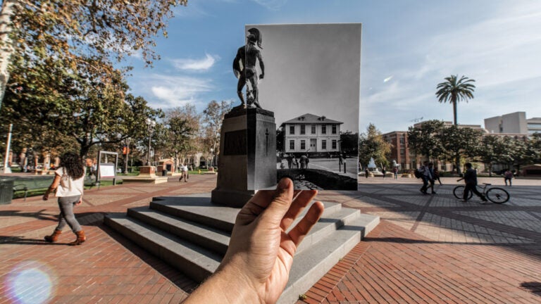 Tommy Trojan next to picture of the old Widney Alumni House location