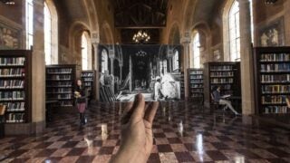 Hoose Library with a hand holding a photo of Hoose library in the past