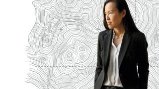 Emily Ryo in front of a map