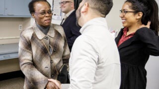 Wanda Austin shaking hands