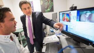 Denis Evseenko, center, has delved into stem cell science and is working to bring his lab's recent scientific discoveries toward clinical trials.