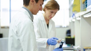 Anthony Ball, a high school senior part of USC's Science, Technology and Research (STAR) program, works on cancer research in USC pharmacologist Houda Alachkar's lab.