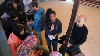 Anya Nutakki interviews young refugees in Lesvos, Greece. (Photo/Elias Marcou)