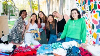 Cambria Estrada (right) and Soraya Levy (second from right) posing with Bloom boutique staff