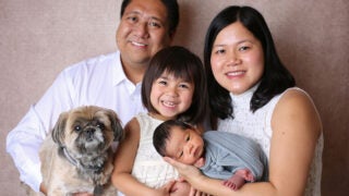 Teri and Michael Odoca family phot with their two children and small dog