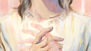 Woman wearing virtual reality goggles holding a translucent hand