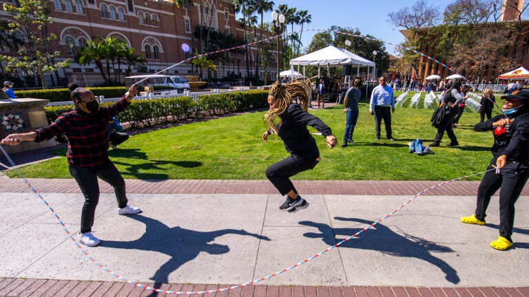 students and staff playing double dutch
