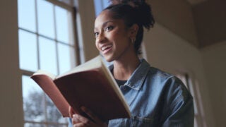woman holding a book