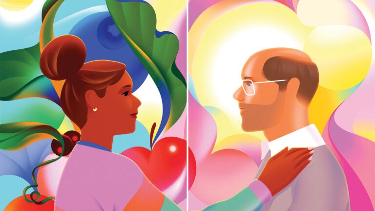 Man and woman staring at each other as the woman touches the mans shoulder