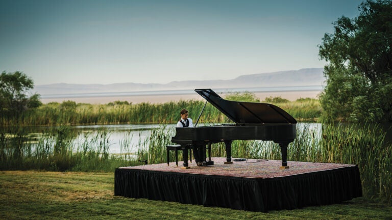 Hunter playing piano at Playa in Summer Lake, Oregon