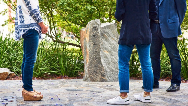 Japanese American family of USC alumni view a rock garden on campus