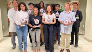 undergraduate students pictured with faculty