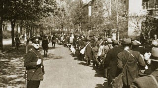 Jewish deportees, carrying a few personal belongings