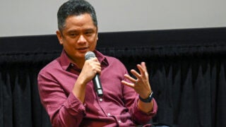 Rodney speaking to audience