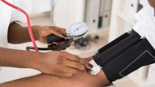 doctor checking blood pressure