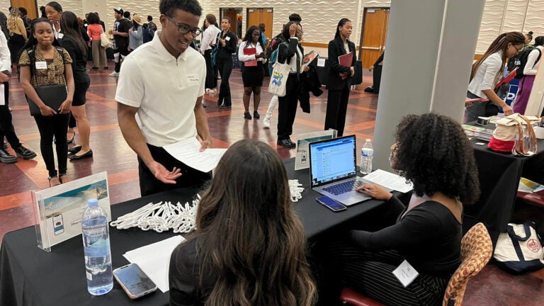 students speaking with recruitment at career fair