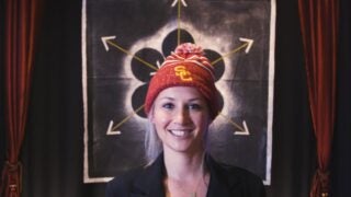 female wearing USC beanie