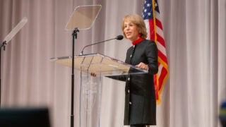 USC President Carol Folt speaking at a podium