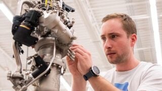 Joe Laurienti works on engine