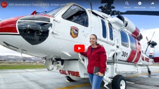 Amber Lynn Scott in front of an airplane