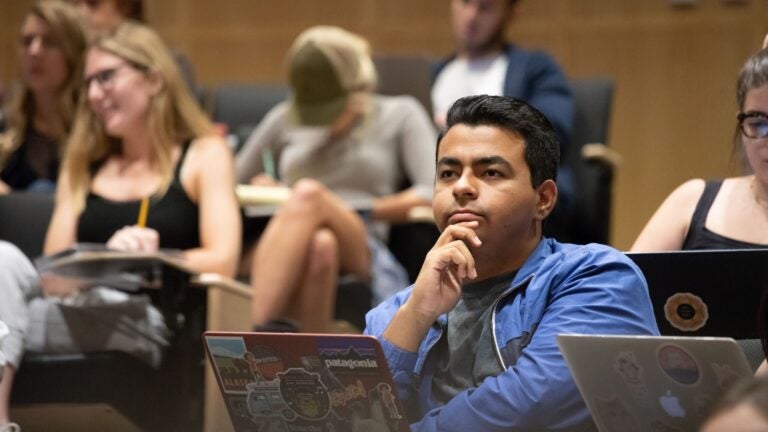 Student in class with laptop
