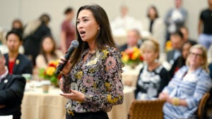 USC Alumni Association leadership conference: Ruth Benson asks a question of President Carol L. Folt