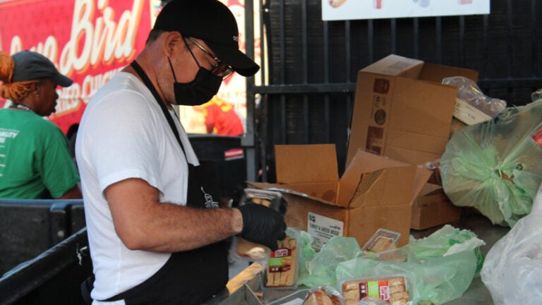 Coliseum sustainability: Sorter goes through trash